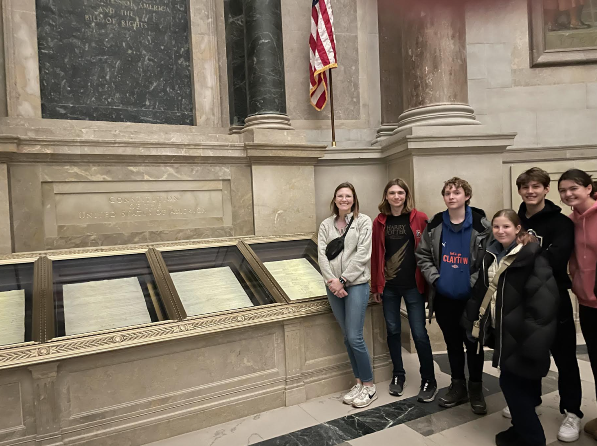 In the Rotunda for the Charters of Freedom, social studies teacher Kate Lyons, senior Kian Eghtesady, sophomore Gabriel Talsky, junior Dasha Arnold, senior Lance Sheets and senior Alyssa Blanke view the The U.S. Constitution, housed in the National Archives Museum in Washington, D.C.

